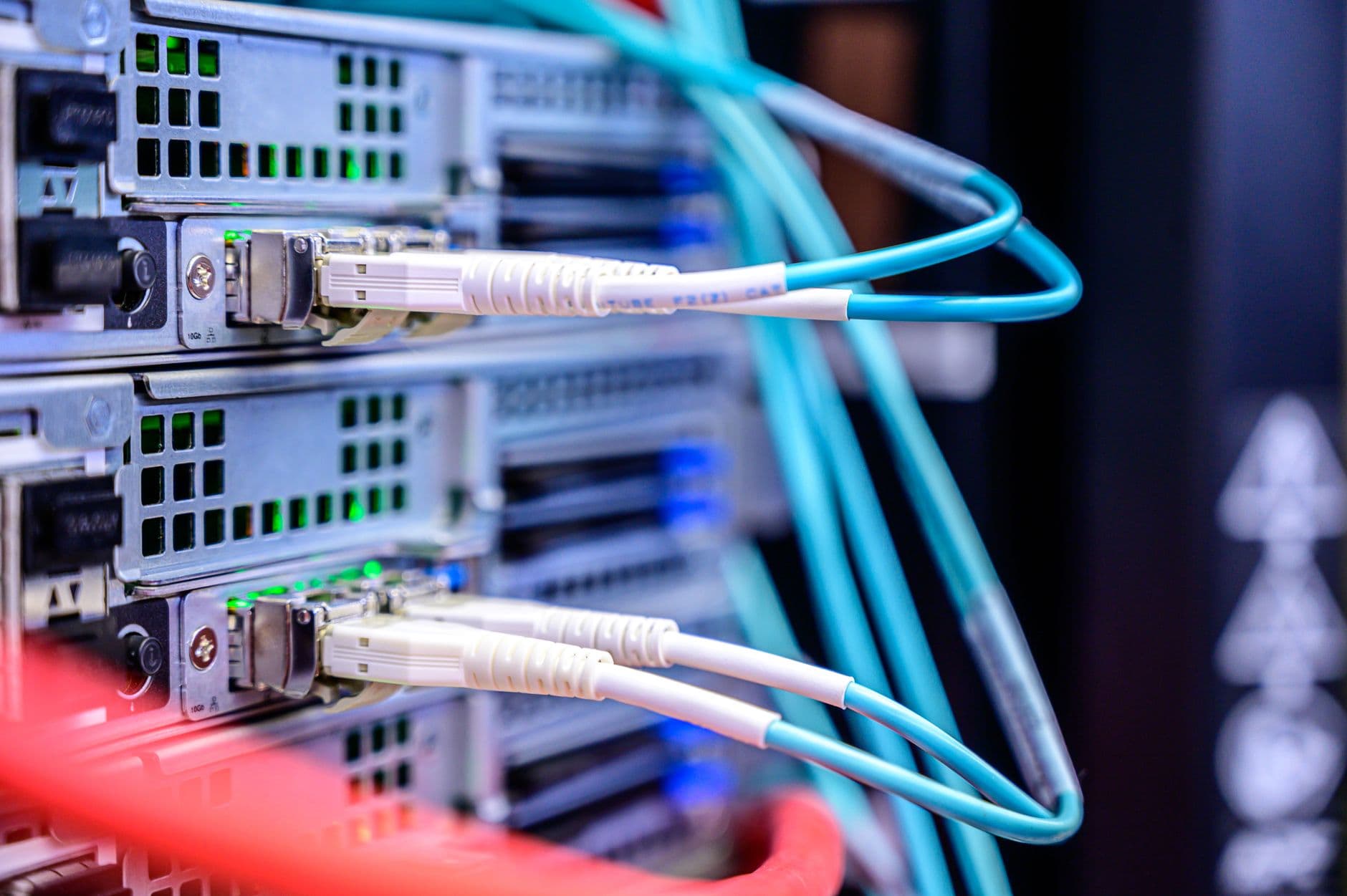 Fiber cables connected to the network ports of rack servers