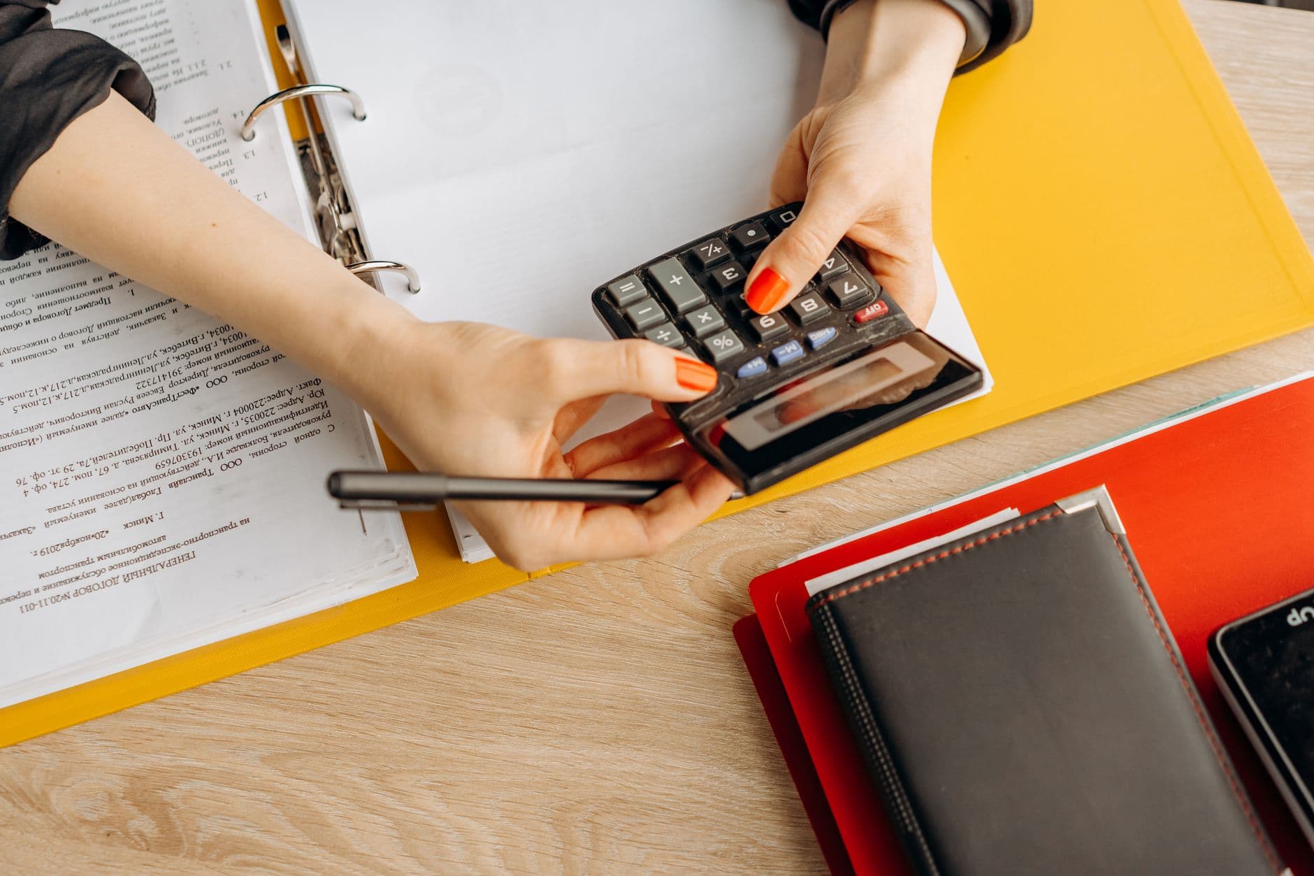 Accountant's desk with documents and a calculator