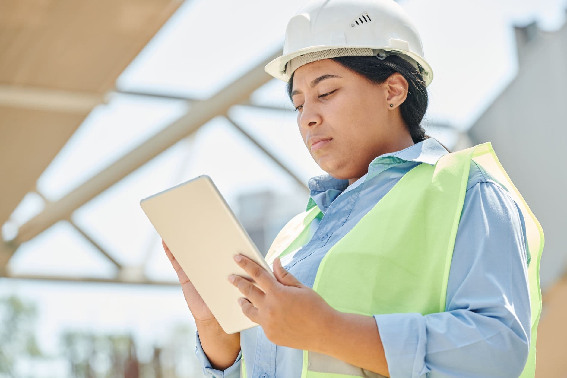 Engineer with a tablet at a construction site