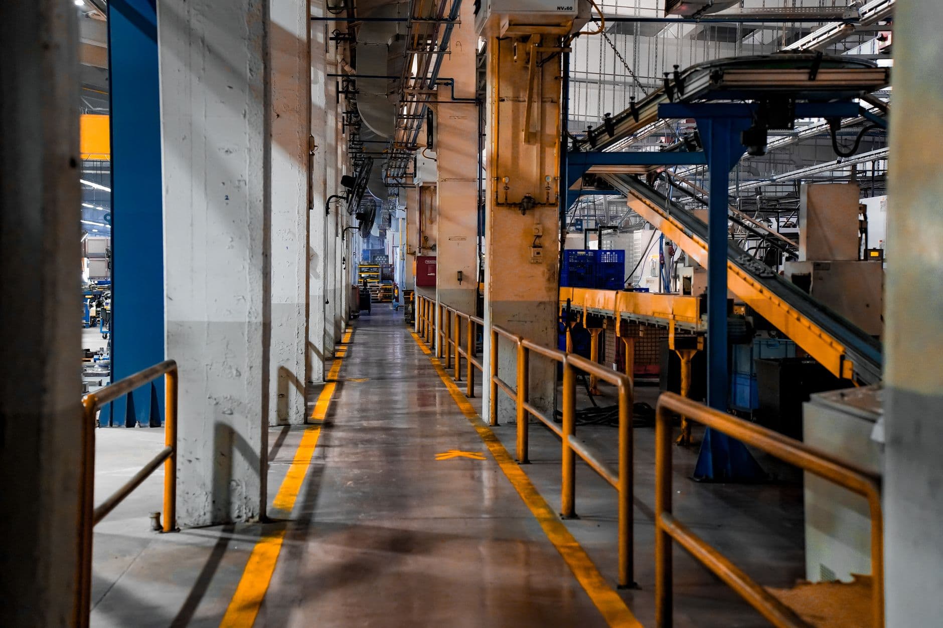 Industrial production line with an engineer overseeing it