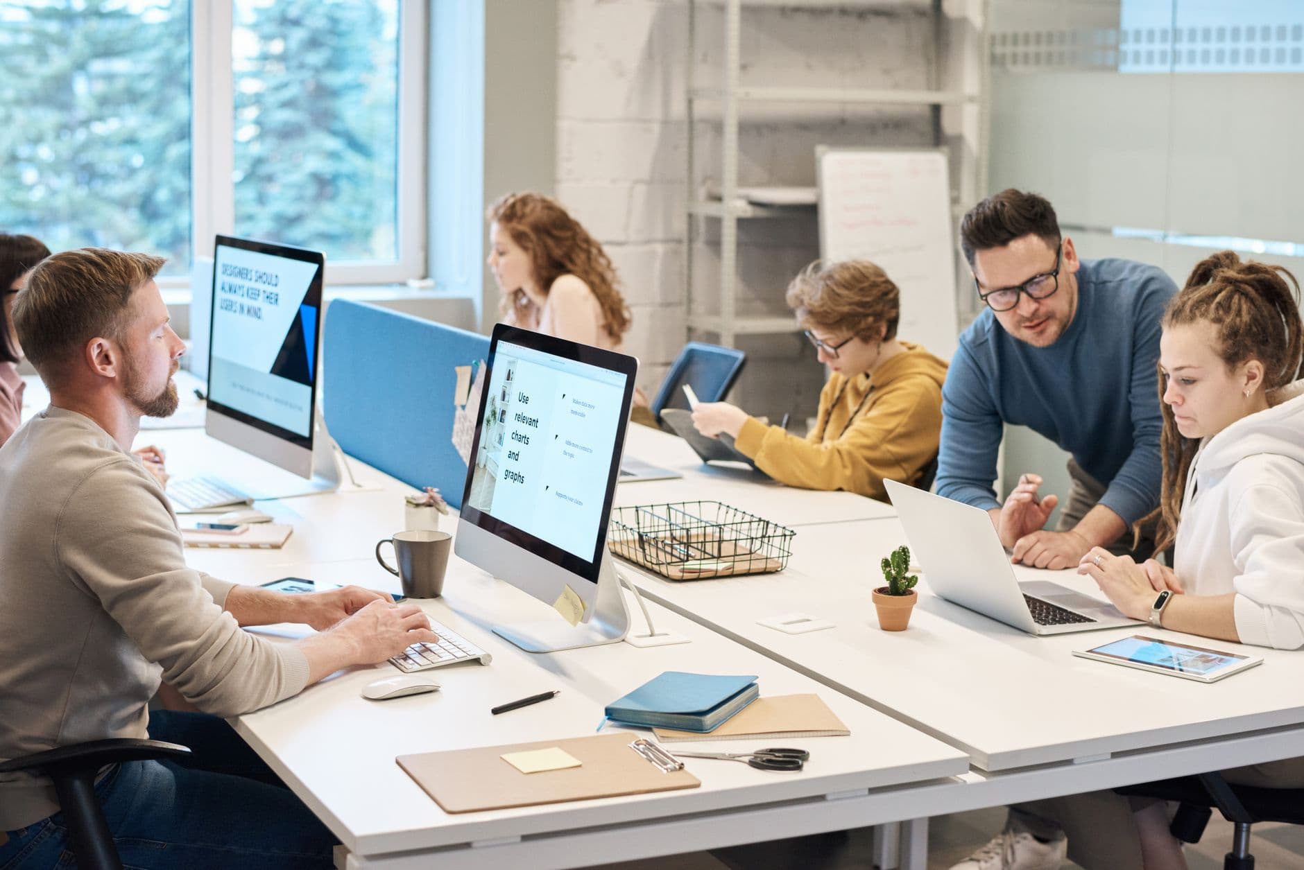 Office with several workstations and computers in use