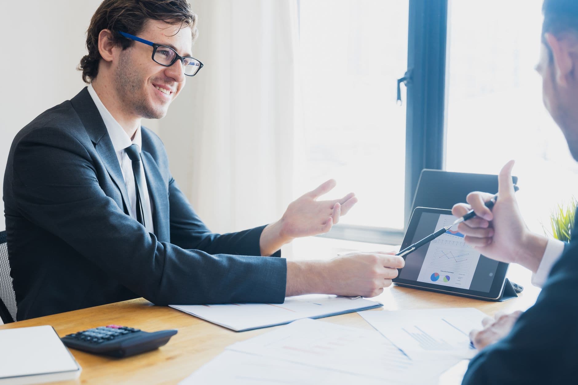 Consultant presenting a technology plan in a meeting with the client