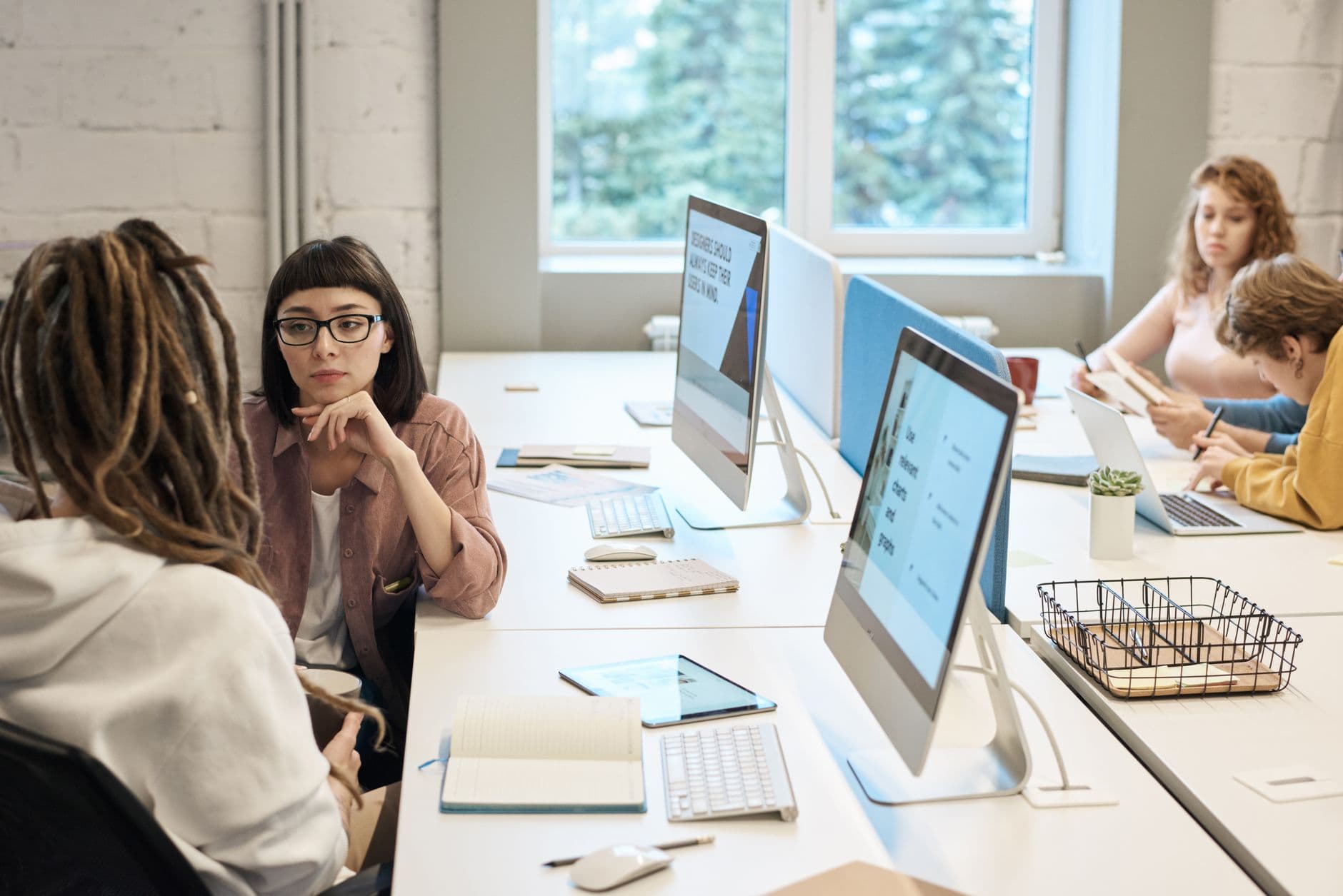 Team working at desktop computers in an open-plan office