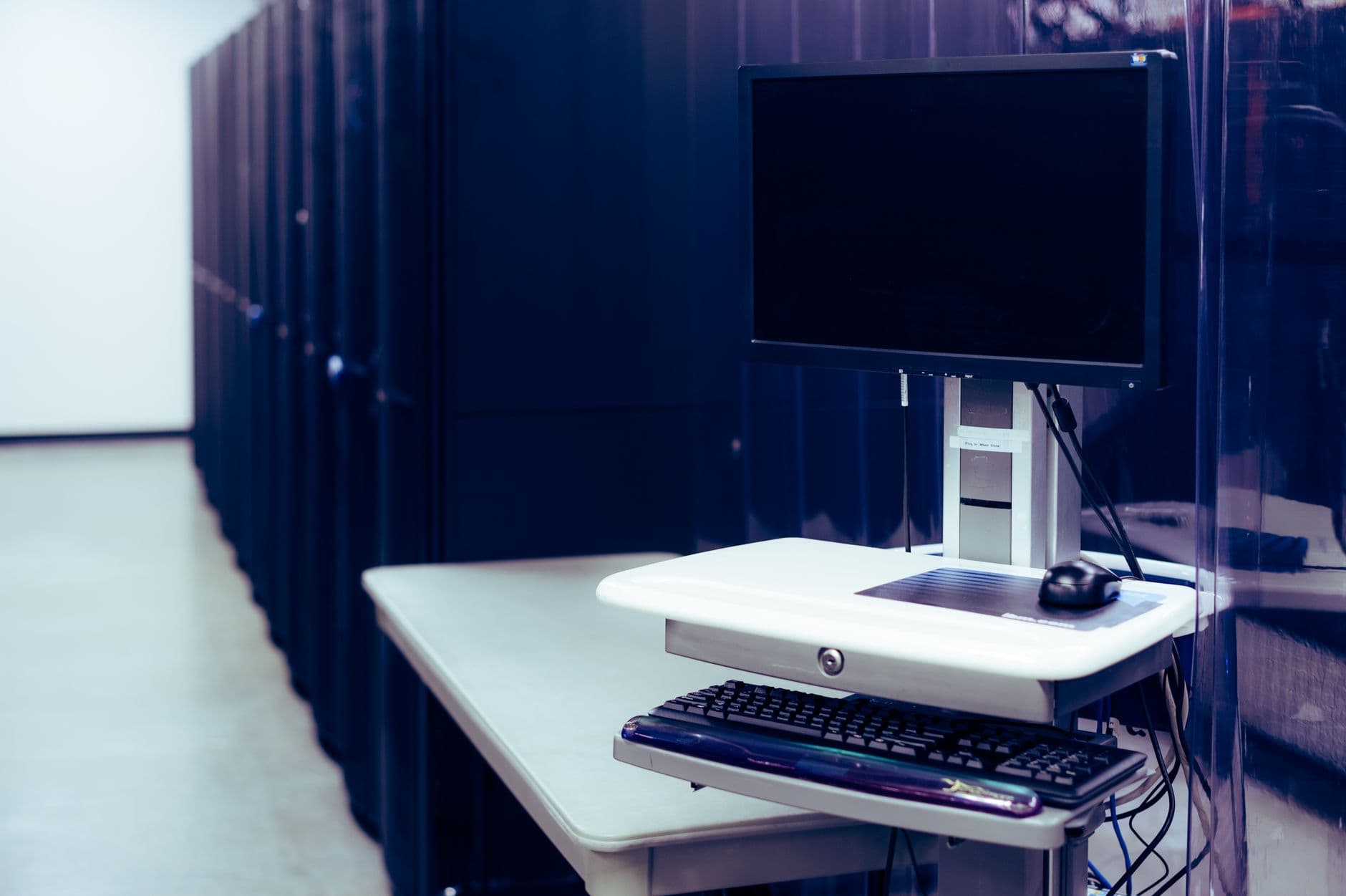 Workstation next to the server racks in a data center